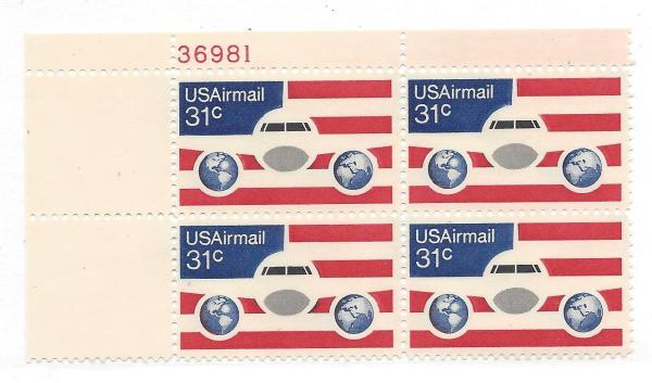 United States | Plane Globes and Flag Plate Block of Four 31-Cent United States Air Mail Postage Stamps Red, blue, and black Stamp Red, blue, & black